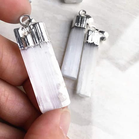silver-selenite-necklace-hellaholics-hand