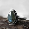 Spellbinding teardrop shaped Sterling Silver Labradorite ring in blue and green colours on white background