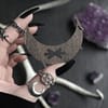 hagal-rune-crescent-brown-hellaholics-hand