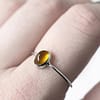 theia-amber-silver-ring-finger-closeup-hellaholics