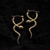 viper-stainless-steel-gold-snake-earrings-hellaholics-black-background