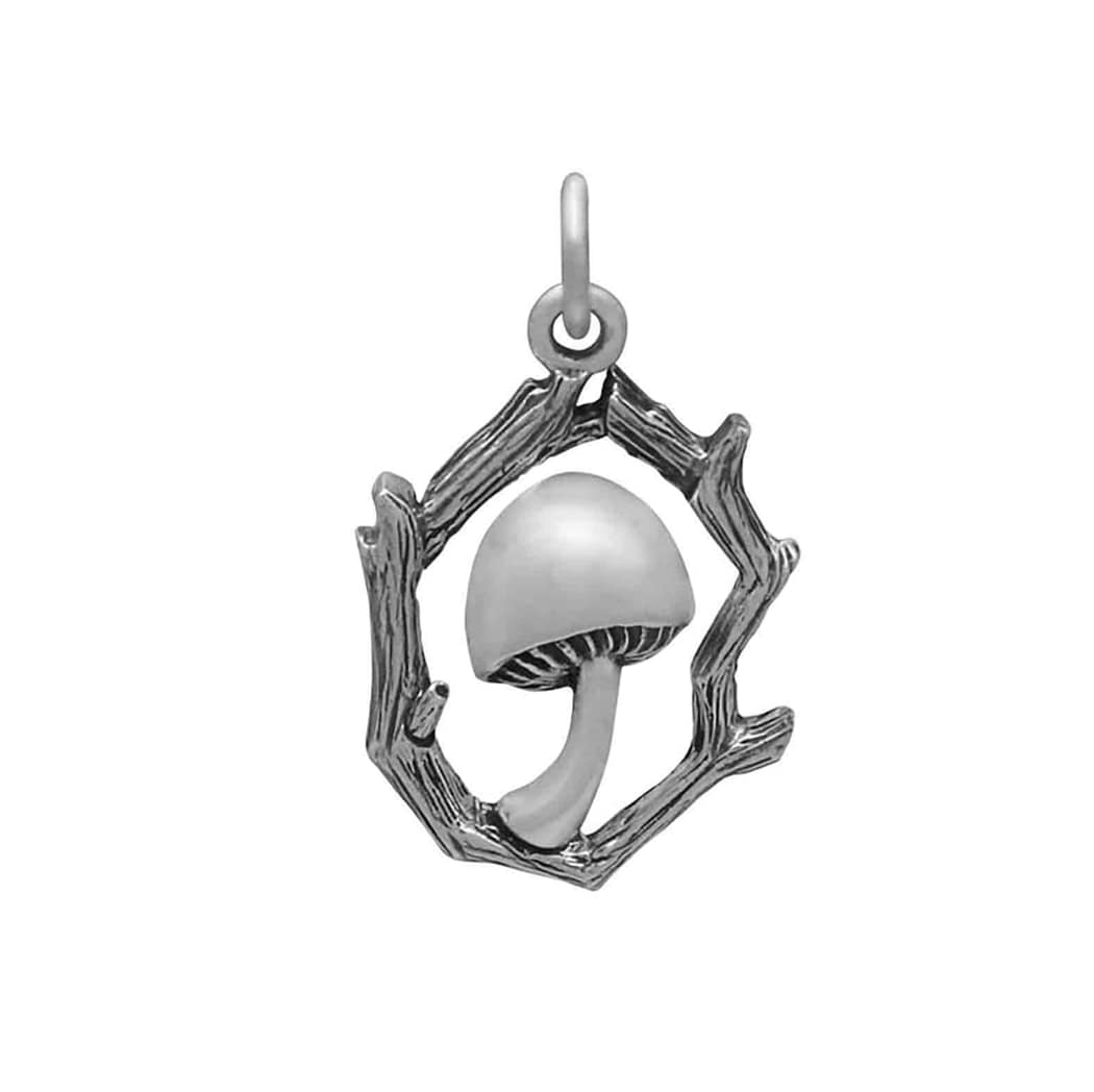 toadstool-silver-necklace-hellaholics-front Close-up view of a recycled sterling silver necklace with intricate details and oxidised finish, the necklace is a mushroom enframed in branches, all white background