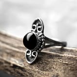 amandi gothic stone ring with silver details on a brown branch