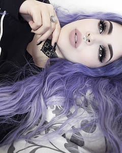 alternative model tavujeus wears a purple wig and hellaholics 90s black lace choker