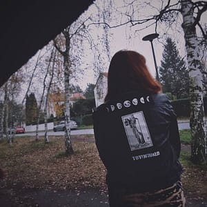 moonphase patch on denim vest, worn by redhead forest of october