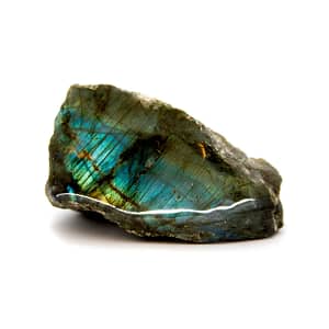 crystla knowledge, raw labradorite stone with one polished side, magical colour spectrum in blue and green, white background