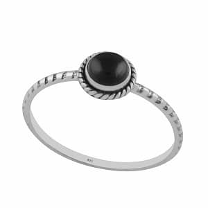 Round petite black Onyx Stacking Ring in lightweight sterling silver on white background side view