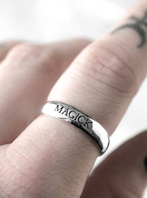 Sterling silver ring with the text "magick"