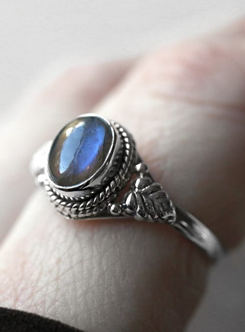Close up photo on sterling silver ring with labradorite crystal stone.