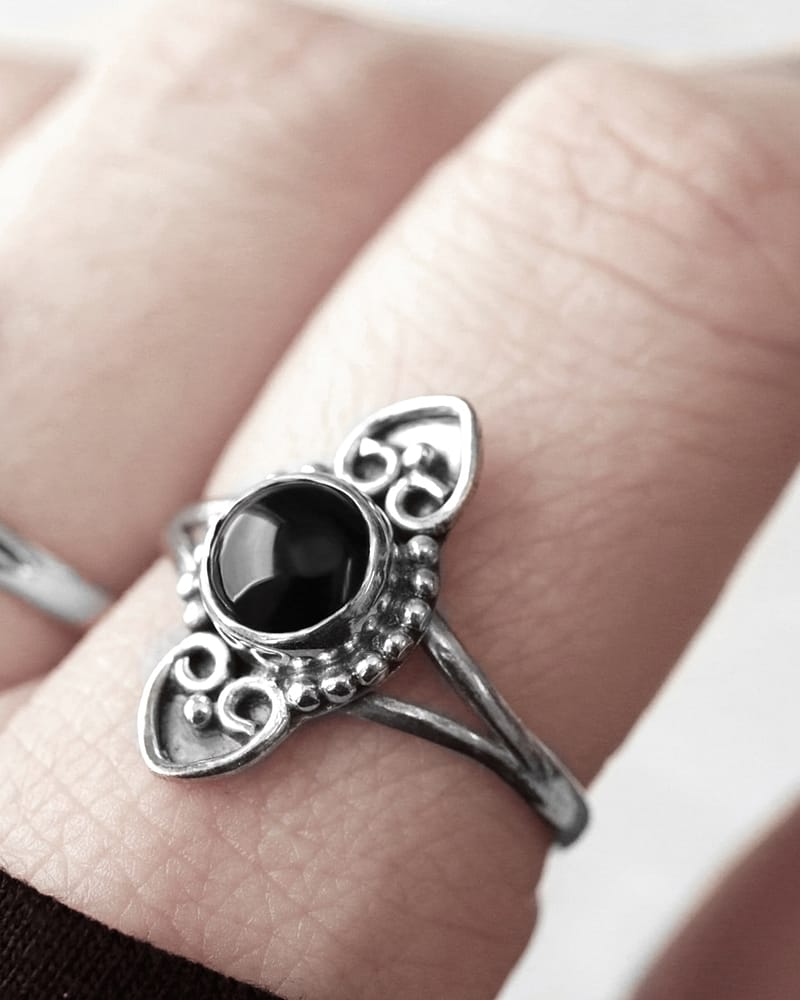 Amadi gothic stone ring with a black onyx stone, close up photo on finger