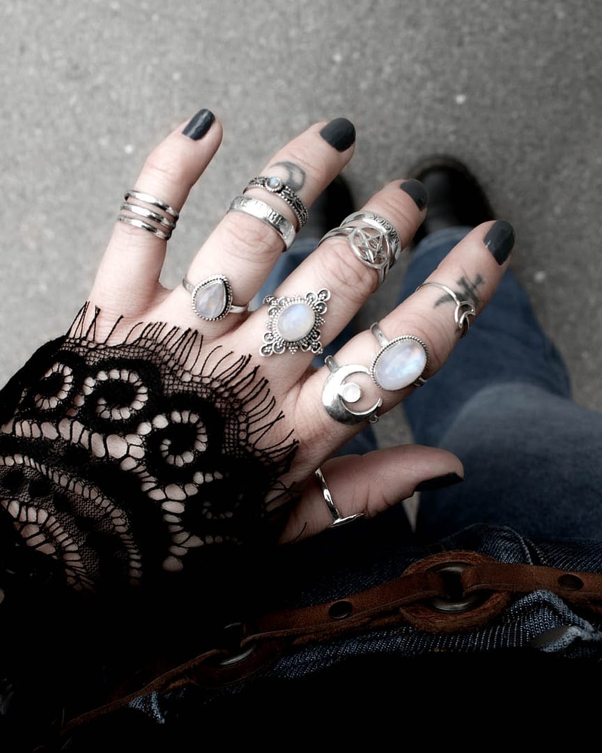 elara-ariana-gaia-moonstone-hunting-moon-pentagram-so-mote-it-be-magick-aranza-silver-rings-hellaholics (2) SIlver moonstone rings styled with black lace and denim flares